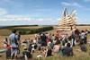 Students visiting Studio Weave’s finished Fire Folly beacon.