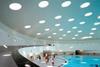 A long ramp leads down from the entrance hall into the elliptical covered pool.  Lighting is by way of 62 circular skylights which draw light spots on the moving water.