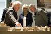 The Prince of Wales, Britain's Prince Charles, Camilla, Duchess of Cornwall and British architect David Chipperfield, from right, look at a scale model of the Berlin city center as they visit the New Museum in Berlin, on Thursday, April 30, 2009.