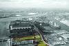 Looking west over the Royal Docks site towards Canary Wharf.