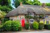 shutterstock_Thatched cottage in Lulworth Dorset_chocolate box traditional English village