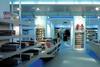 Display compartments are painted sky blue and fitted with concealed fluorescent tubes that glow blue beneath the units.