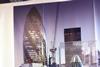 Model of The Pineapple (aka The Gherkin) in front of photo of 100 Bishopsgate site with a great view of the real Pineapple behind