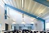 Exposed steel structure inside a classroom at Penoyre & Prasad's Wren Academy.