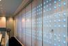 The Pep wall is set against an east-facing window, so milky natural light filters into the room.  Embedded into the honeycomb plastic are 324 LEDs to create a light installation.
