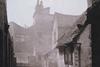 Photographed in 1938, the backs of houses in the City of London’s Cloth Fair show a sight common in the medieval city.