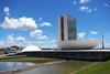 Oscar Niemeyer's Brazilian National Congress in Brasilia. The administrative towers - Annex I - are flanked by the domed Senate and the bowl-shaped Chamber of the Deputies