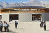 The granite outer walls of the Pema Karpo Library in Ladakh, northern India, contrast with the internal timber panelling.