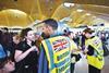 Embassy staff help passengers at Madrid’s Barajas airport.