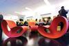 Colourful Ron Arad- designed rocking chairs in the common room.