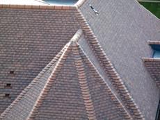 This development used Marley Eternit Acme double camber clay plain tiles in Antique.