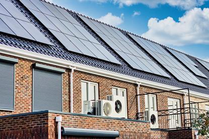 Heat pump technology in row of houses credit Shutterstock