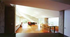 The entry space and kitchen is the focal point of Thompson’s West Coast House in Victoria, Australia.