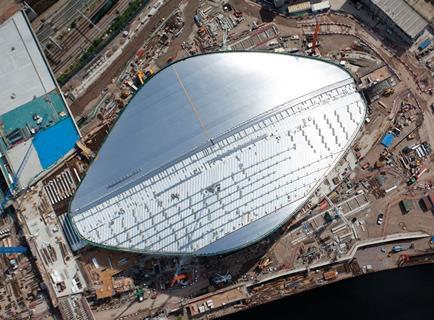 The partly complete wave-like roof of Zaha Hadid’s Olympic Aquatics Centre.