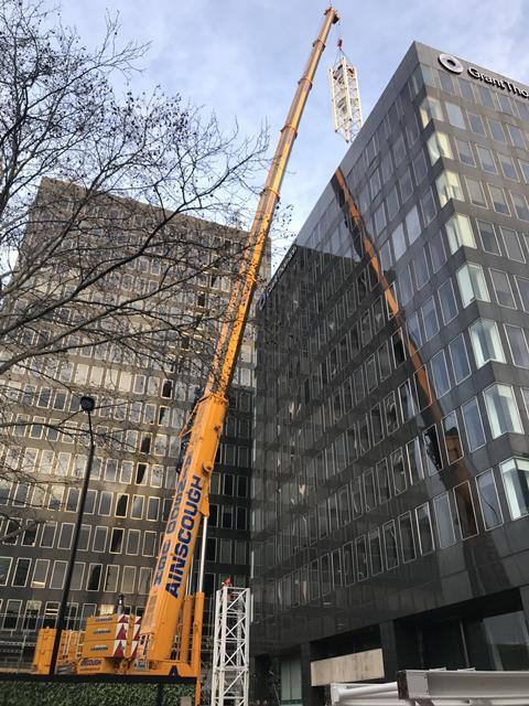 A crane is erected ahead of the demolition of Richard Seifert's Euston towers