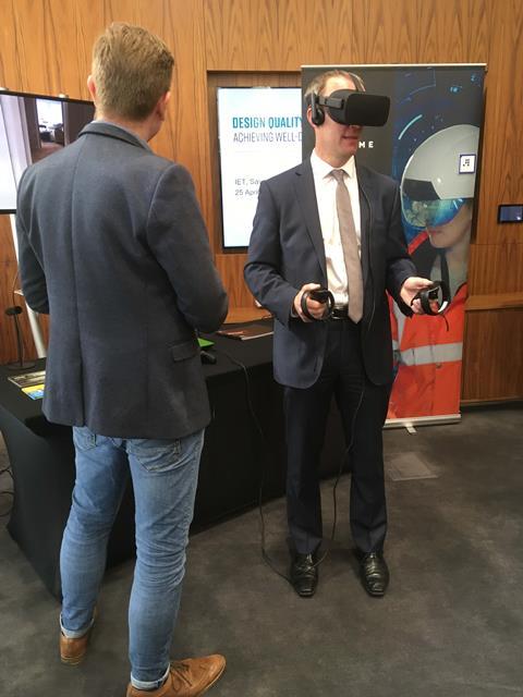 Dominic Raab tries on a VR headset at the Design Quality Conference