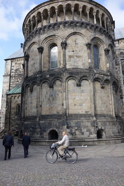 Lund in Sweden - man cycling with a crutch