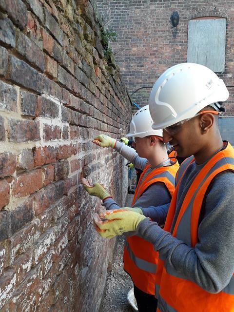 Flaxmill construction-students-using-traditional-lime-mortar-for-repointing