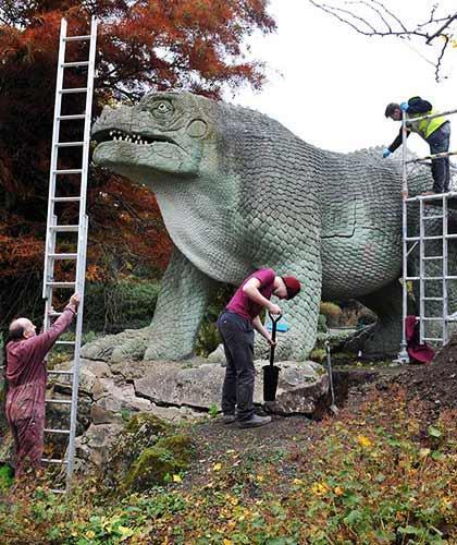 Restoration work taking place on one of Crystal Palace Park's dinosaur statues in 2016