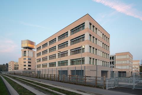 Eric Parry Architects' new headquarters for Cambridge Assessment, with the city's guided busway in the foreground