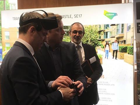 Dominic Raab tries on a VR headset at Design Quality Conference watched by Andy von Bradsky 2