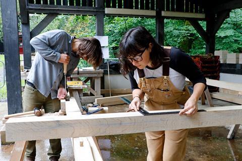 Building Arts Programme students Jim Nightingale and Florence Hamer creating the Shepherd Hut timber frame