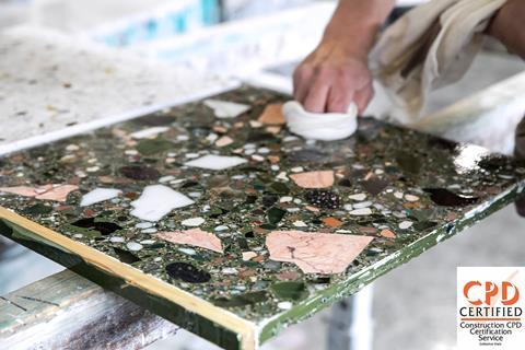 Polishing terrazzo sample with logo