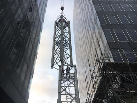 A crane is erected ahead of the demolition of Richard Seifert's Euston towers