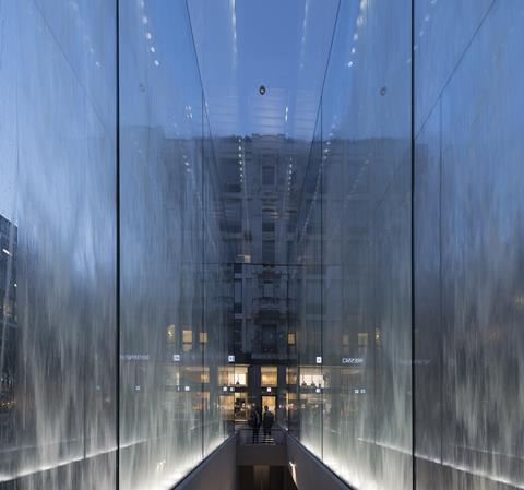 Entrance to Foster & Partners' Apple store in Piazza Liberty, Milan, through a glass water fountain