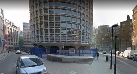 Fenced-off section of Space House at the junction of Keeley street and Wild Street