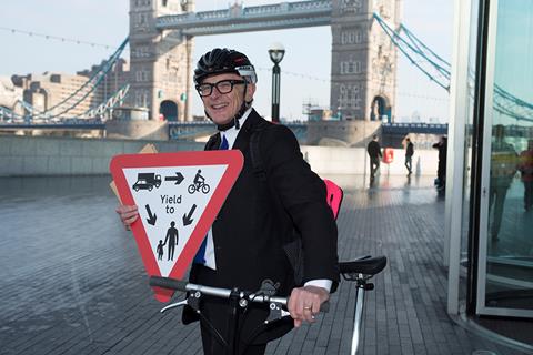 Peter Murray with a Golding Rule sign