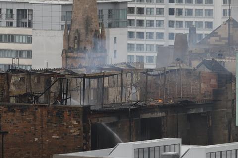 The extent of the damage is clear as firefighters tackle the last pockets of the second fire at the Mackintosh Building in Glasgow, June 2018