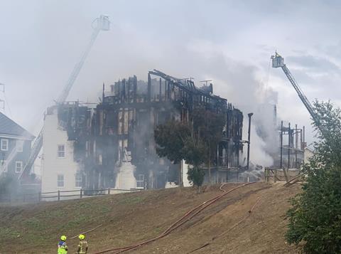 The smouldering remains of Priors Barn House, in Worcester Park, south London