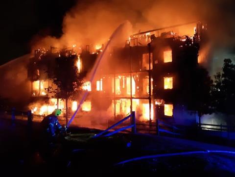 Fire rages at the flats in Worcester Park, south London
